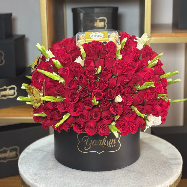 Caja circular con 150 rosas, 24 gladiolas, ferrero & 2 mariposas